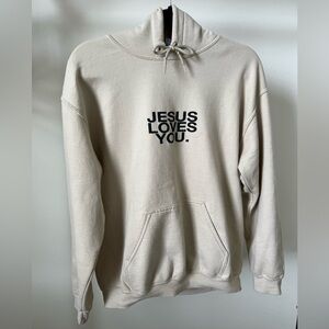 Tan Jesus Loves You hoodie with black lettering, size medium, writing on back